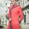 Áo dài nam cách tân màu cam vẽ hoa văn độc lạ